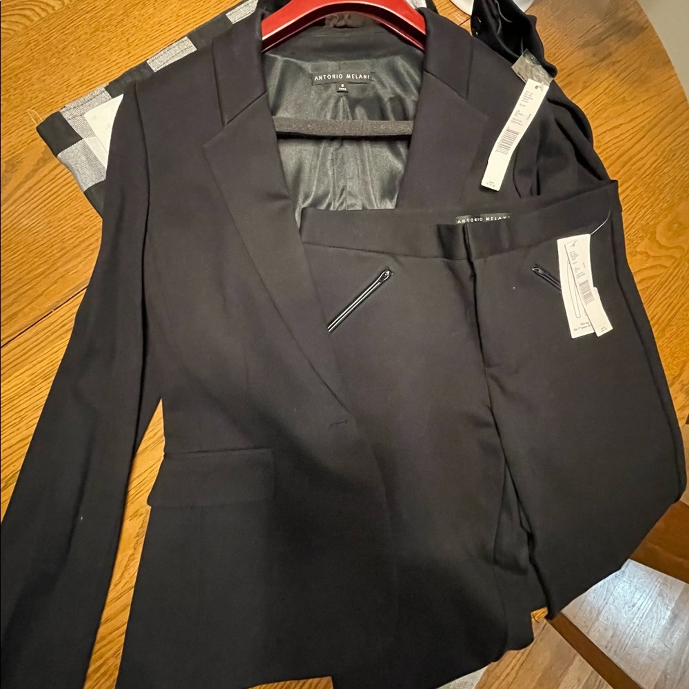Antonio Melani Black Suit size 6 and pants size 8.  Will separate if needed.